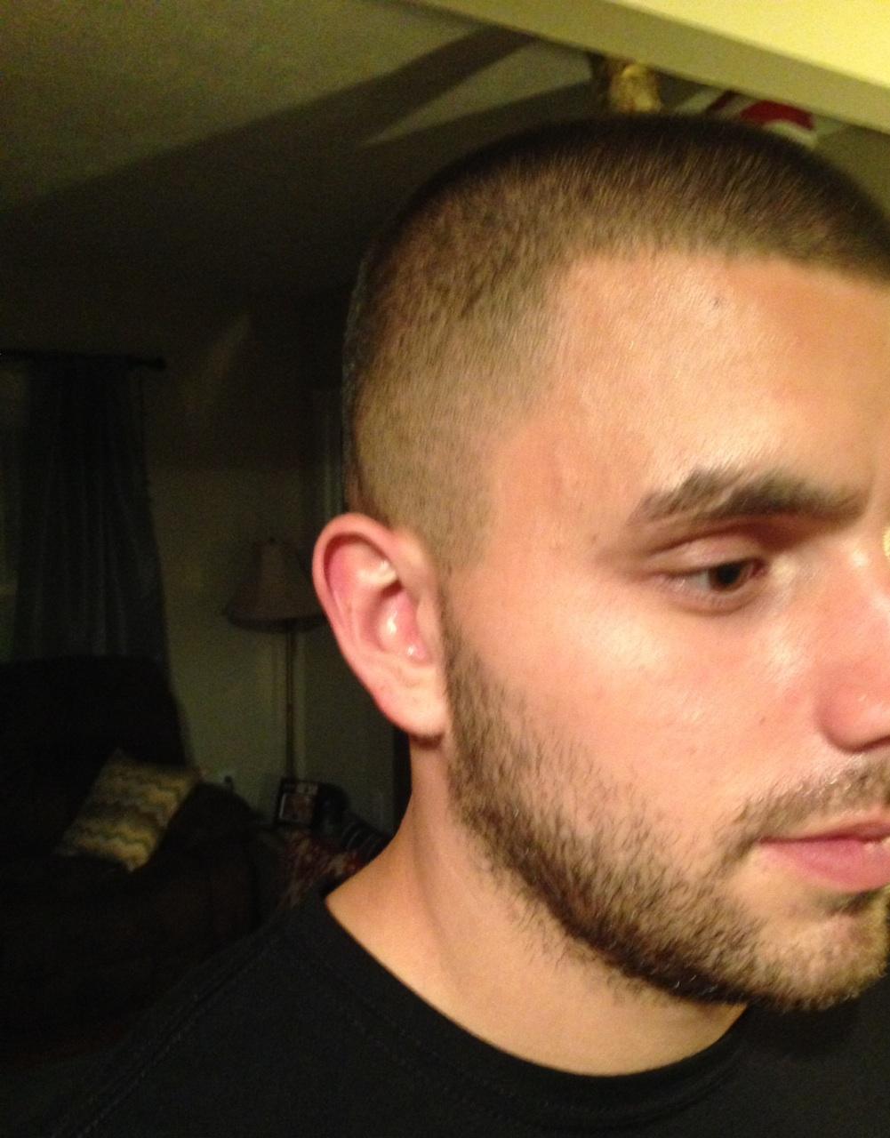Close-cut hairstyle and beard detail, photographed at the shop
