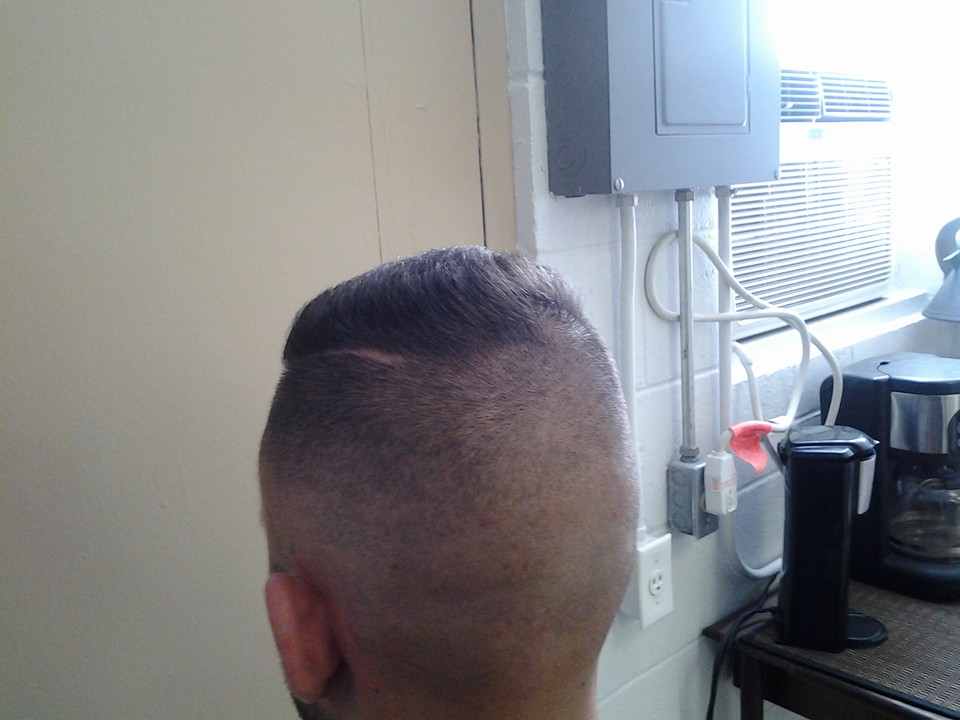 Rear view of a neat tapered haircut at Willard Barber Shop